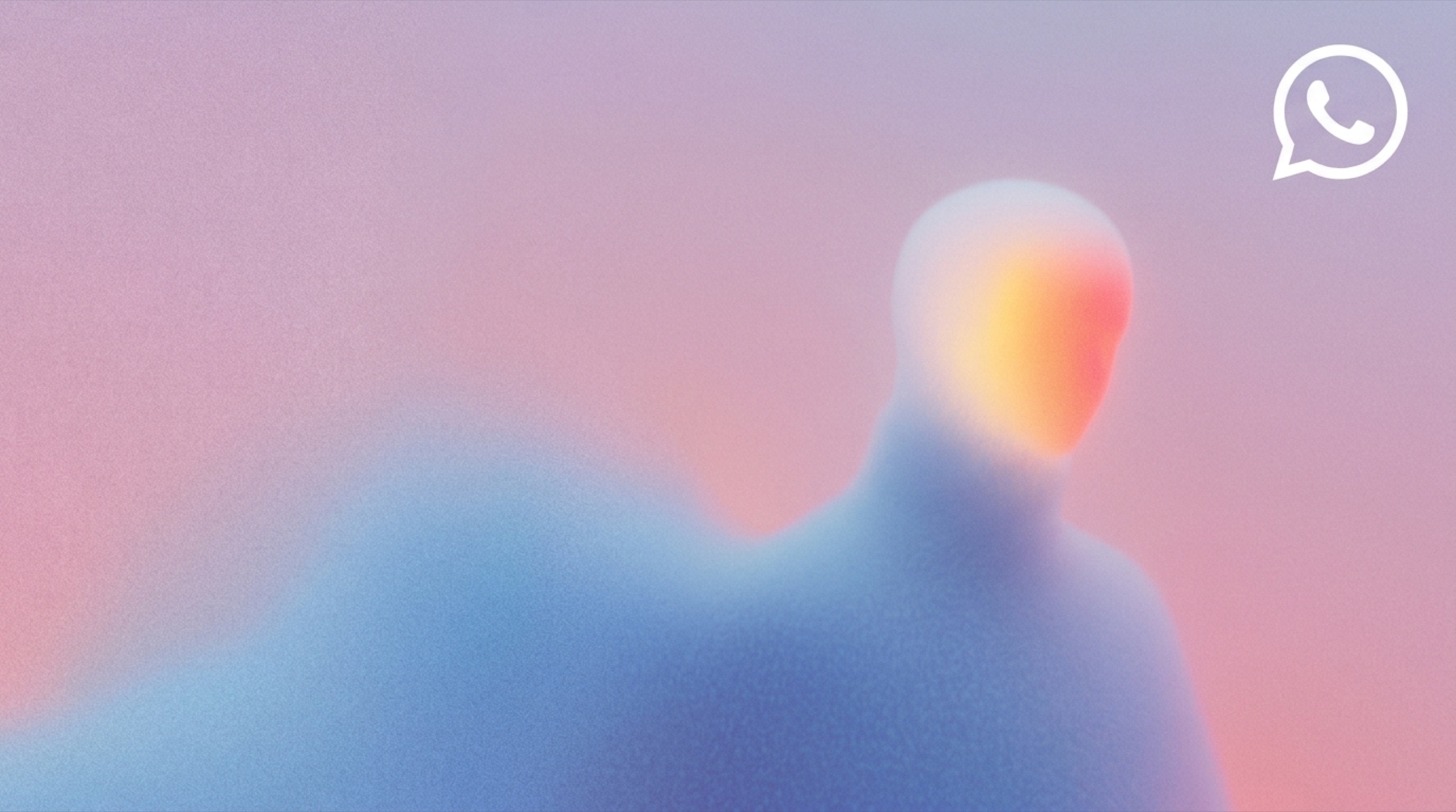 Soft-focus silhouette of a person in pastel colours with a warm glow on the face, the WhatsApp logo in white in the top right